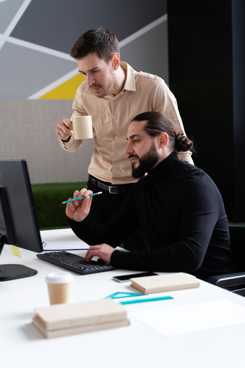 medium shot men working together office (1)